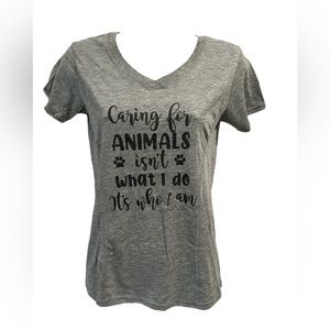 Woman's Caring for animals isn’t what I do it’s who I am v-neck t-shirt.